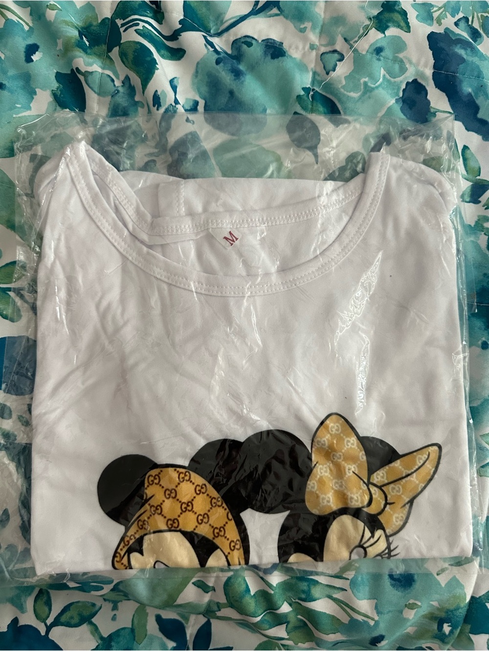 White Short Sleeve Graphic Tee with Gold Bow Detail - Brand Not Visible